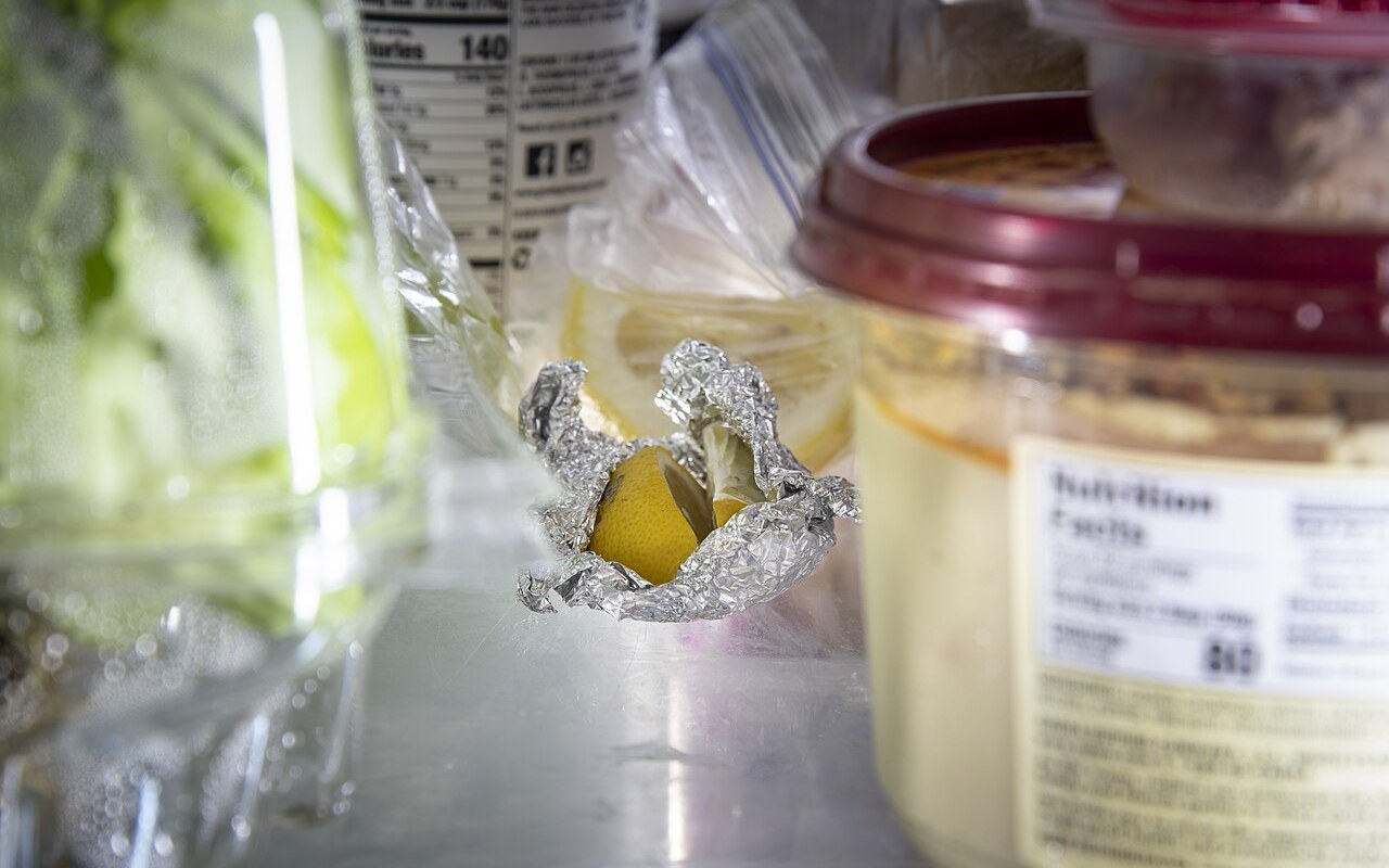 Appliance care guide for freezers and refrigerators checklist scene beside a freezer or refrigerator