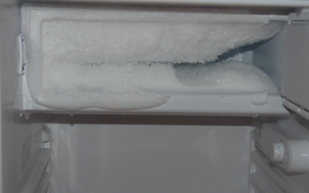 Defrosting tools and freezer maintenance checklist checklist scene beside a freezer or refrigerator