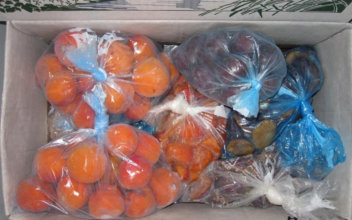 Freezer basket buying guide for chest and upright freezers shown with labeled freezer containers
