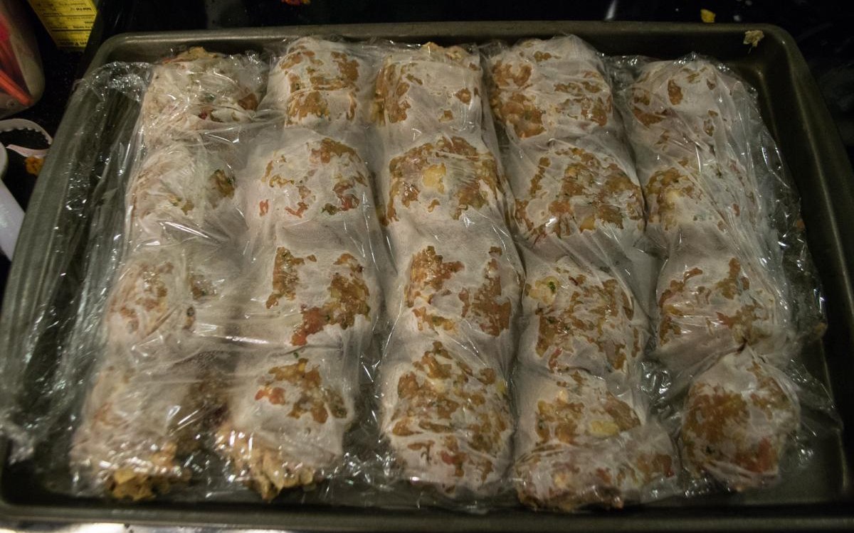 Pantry-to-freezer storage checklist example with cold-storage bins and food containers
