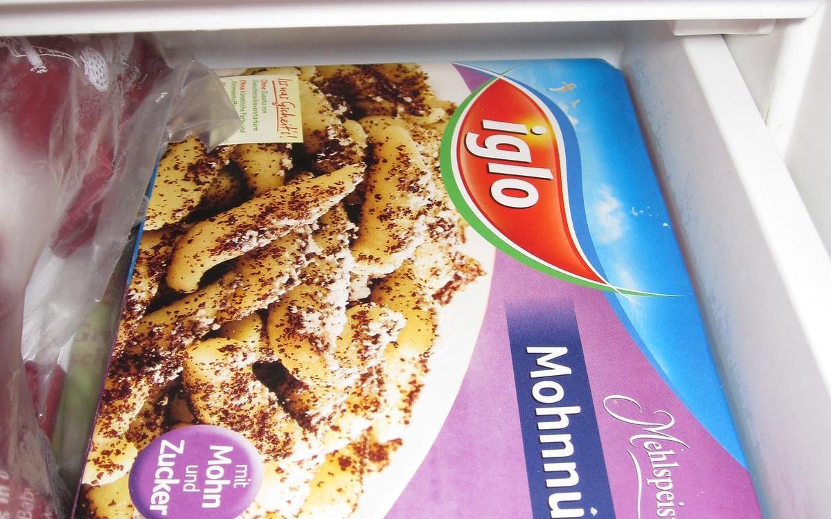 Small freezer organization guide for apartments shown with labeled freezer containers